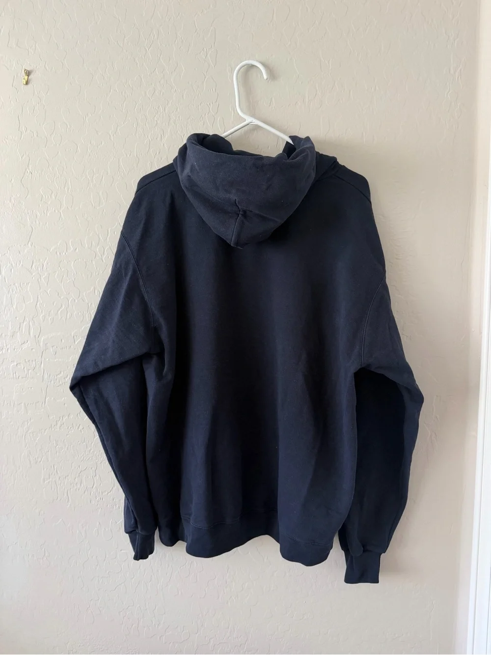 Champion Navy Hoodie with Carolina Arch and Light Blue Logo